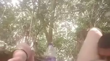 Mistress lets her servant lick her pussy during outdoor sex