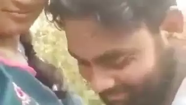 Indian outdoor sex of a guy sucking his GF’s tight boobs